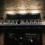 A sign that says ferry market.