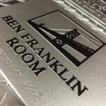 A close up of the ben franklin room sign