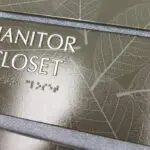 A close up of the sign for the closet