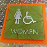 A sign that says women and handicap.