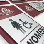 A close up of the women 's restroom sign