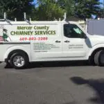 A white truck with the words mercer county chimney services on it.