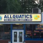 A store front with the sign for all quatics.