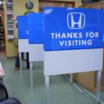 A row of blue and white signs that say " thanks for visiting ".