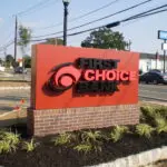 A sign that says first choice bank.