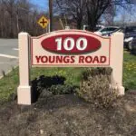 A sign that says 1 0 0 youngs road